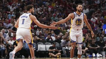 MIAMI, FL - NOVEMBER 01: Stephen Curry #30 of the Golden State Warriors congratulates Klay Thompson #11 after making a three-point shot during the second half against the Miami HEAT at FTX Arena on November 1, 2022 in Miami, Florida. NOTE TO USER: User expressly acknowledges and agrees that, by downloading and or using this photograph, User is consenting to the terms and conditions of the Getty Images License Agreement.  Eric Espada/Getty Images/AFP