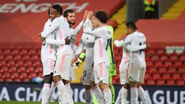 LIVERPOOL, ENGLAND - APRIL 14: Eder Militao of Real Madrid celebrates victory with team mates following the UEFA Champions League Quarter Final Second Leg match between Liverpool FC and Real Madrid at Anfield on April 14, 2021 in Liverpool, England. Sport