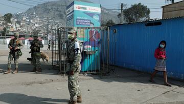 Soldiers keep watch in Cantagallo, an indigenous Shipibo-Conibo community, during the vaccination campaign against the coronavirus disease (COVID-19), in Lima, Peru February 19, 2021. REUTERS/Angela Ponce