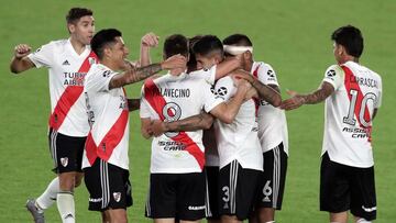 River Plate's defender Fabrizio Angileri celebrates with teammates after scoring the team's second goal against Colon during their Argentine Professional Football League match at the Monumental stadium in Buenos Aires, on April 11, 2021. (Photo by ALEJANDRO PAGNI / AFP)