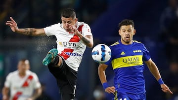 Soccer Football - Copa Libertadores - Group  E - Boca Juniors v Always Ready - Estadio La Bombonera, Buenos Aires, Argentina - April 12, 2022. Always Ready's Juan Arce in action with Boca Juniors' Oscar Romero REUTERS/Agustin Marcarian