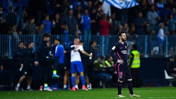 MALAGA, SPAIN - APRIL 08: Lionel Messi of FC Barcelona looks on dejected after Jony Rodriguez of Malaga CF scored his team's second goal during the La Liga match between Malaga CF and FC Barcelona at La Rosaleda stadium on Apr