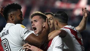 River Plate's midfielder Agustin Palavecino (C) celebrates with teammate Colombian forward Miguel Borja after scoring a goal during the Professional League Cup football match between Agentinos Juniors and River Plate and at Diego Armando Maradona stadium in Buenos Aires, on August 20, 2023. (Photo by ALEJANDRO PAGNI / AFP)