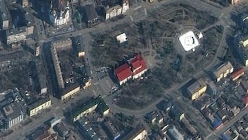 A satellite image shows Mariupol Drama Theatre before bombing, as a word &quot;children&quot; in Russian is written in large white letters on the pavement, in front of and behind the building, in Mariupol, Ukraine, March 14, 2022. Picture taken March 14, 