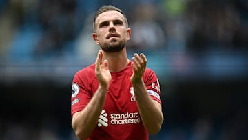 (FILES) Liverpool's English midfielder Jordan Henderson applauds fans on the pitch after the English Premier League football match between Manchester City and Liverpool at the Etihad Stadium in Manchester, north west England, on April 1, 2023. Liverpool captain Jordan Henderson has completed his move to Saudi Pro League side Al-Ettifaq, both clubs announced on Wednesday, July 27. (Photo by Paul ELLIS / AFP) / RESTRICTED TO EDITORIAL USE. No use with unauthorized audio, video, data, fixture lists, club/league logos or 'live' services. Online in-match use limited to 120 images. An additional 40 images may be used in extra time. No video emulation. Social media in-match use limited to 120 images. An additional 40 images may be used in extra time. No use in betting publications, games or single club/league/player publications. / 