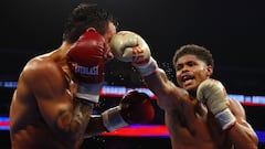 NEWARK, NEW JERSEY - JULY 06: Shakur Stevenson (gold gloves) trades punches with Artem Harutyunyan of Germany (red gloves) during their WBC Lightweight World Title fight at Prudential Center on July 06, 2024 in Newark, New Jersey.   Sarah Stier/Getty Images/AFP (Photo by Sarah Stier / GETTY IMAGES NORTH AMERICA / Getty Images via AFP)