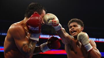 NEWARK, NEW JERSEY - JULY 06: Shakur Stevenson (gold gloves) trades punches with Artem Harutyunyan of Germany (red gloves) during their WBC Lightweight World Title fight at Prudential Center on July 06, 2024 in Newark, New Jersey.   Sarah Stier/Getty Images/AFP (Photo by Sarah Stier / GETTY IMAGES NORTH AMERICA / Getty Images via AFP)