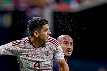 Mexico defender Jesus Angulo (L) in action against Paraguay forward Carlos Gonzalez 
