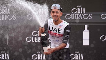 Team UAE Emirates' Columbian rider Sebastian Molano celebrates on the podium after winning the stage 12 of the 2023 La Vuelta cycling tour of Spain, a 150,6 km race between Olvega and Zaragoza, on September 7, 2023. (Photo by CESAR MANSO / AFP)