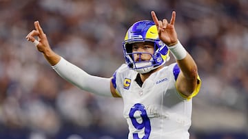 ARLINGTON, TEXAS - OCTOBER 29: Matthew Stafford #9 of the Los Angeles Rams signals for a two-point conversion after a touchdown in the third quarter of a game against the Dallas Cowboys at AT&T Stadium on October 29, 2023 in Arlington, Texas.   Ron Jenkins/Getty Images/AFP (Photo by Ron Jenkins / GETTY IMAGES NORTH AMERICA / Getty Images via AFP)