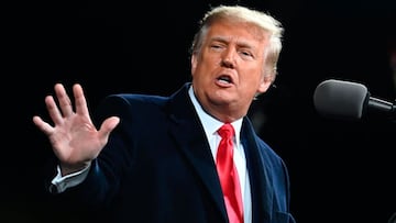 President Donald Trump gestures as he speaks at a rally to support Republican Senate candidates in Georgia. 