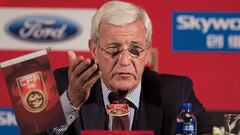 (FILES) This file photo taken on October 28, 2016 shows China&#039;s newly appointed national football team coach Marcello Lippi gesturing during a press conference in Beijing.
 Marcello Lippi said on November 14, 2016, China need to shed their &quot;unde
