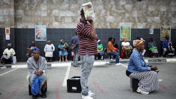 FILE PHOTO: Shoppers queue following social distance rules during a 21 day nationwide lockdown, aimed at limiting the spread of coronavirus disease (COVID-19) in Soweto, South Africa, March 30, 2020. REUTERS/Siphiwe Sibeko/File Photo