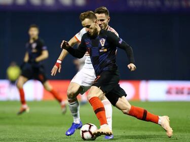 Barcelona await update on injured Rakitic