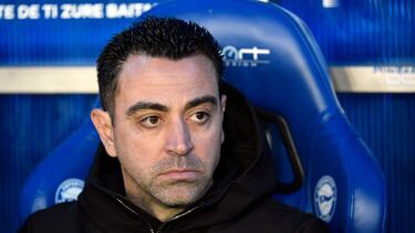 Barcelona's Spanish coach Xavi is pictured sitting on the bench prior to the Spanish league football match between Deportivo Alaves and FC Barcelona at the Mendizorroza stadium in Vitoria on February 3, 2024. (Photo by Ander Gillenea / AFP)