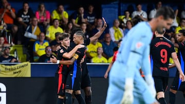 Barcelona's Spanish midfielder #14 Pablo Torre celebrates with teammates after scoring his team's third goal during the Spanish league football match between Villarreal CF and FC Barcelona at La Ceramica stadium in Vila-real, on September 22, 2024. (Photo by JOSE JORDAN / AFP)