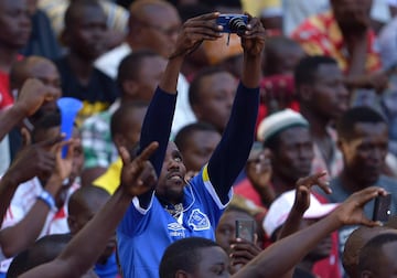 An Everton supporter takes a picture before a friendly between Everton and Kenya's Gor Mahia.