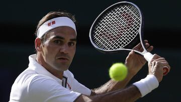 Switzerland's Roger Federer returns to Spain's Rafael Nadal in a Men's singles semifinal match on day eleven of the Wimbledon Tennis Championships in London, Friday, July 12, 2019. (AP Photo/Kirsty Wigglesworth)