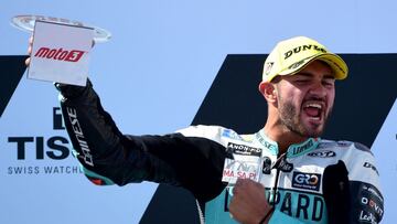 Leopard Racing Italian rider Dennis Foggia celebrates on the podium after winning the Moto3 race of Moto Grand Prix of Aragon at the Motorland circuit in Alcaniz on September 12, 2021. (Photo by LLUIS GENE / AFP)