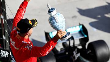 BUDAPEST, HUNGARY - AUGUST 04: Third placed Sebastian Vettel of Germany and Ferrari celebrates on the podium during the F1 Grand Prix of Hungary at Hungaroring on August 04, 2019 in Budapest, Hungary. (Photo by Mark Thompson/Getty Images)