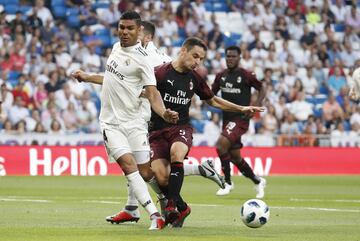 Casemiro (left) is challenged by Milan's Giacomo Bonaventura.