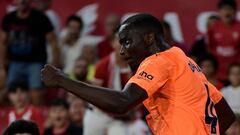 Valencia's Guinean defender #04 Mouctar Diakhaby celebrates scoring his team's first goal during the Spanish Liga football match between Sevilla FC and Valencia CF at the Ramon Sanchez Pizjuan stadium in Seville on August 11, 2023. (Photo by CRISTINA QUICLER / AFP)