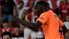 Valencia's Guinean defender #04 Mouctar Diakhaby celebrates scoring his team's first goal during the Spanish Liga football match between Sevilla FC and Valencia CF at the Ramon Sanchez Pizjuan stadium in Seville on August 11, 2023. (Photo by CRISTINA QUICLER / AFP)