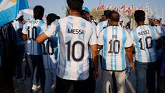 Soccer Football - FIFA World Cup Qatar 2022 Argentina Fan Activity - Doha, Qatar - November 11, 2022 Argentina fans wear Lionel Messi shirts during the march towards the Count Down Clock REUTERS/John Sibley
