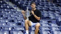 NEW YORK, NEW YORK - SEPTEMBER 11: Carlos Alcaraz of Spain poses with the championship trophy after defeating Casper Ruud of Norway during their Men�s Singles Final match on Day Fourteen of the 2022 US Open at USTA Billie Jean King National Tennis Center on September 11, 2022 in the Flushing neighborhood of the Queens borough of New York City.   Julian Finney/Getty Images/AFP