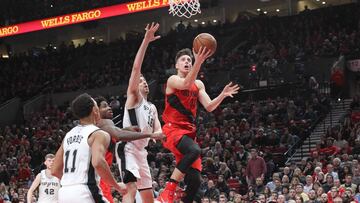 Jan 7, 2018; Portland, OR, USA;  Portland Trail Blazers center Zach Collins (33) shoots over San Antonio Spurs center Pau Gasol (16) in the second half at Moda Center. Mandatory Credit: Jaime Valdez-USA TODAY Sports