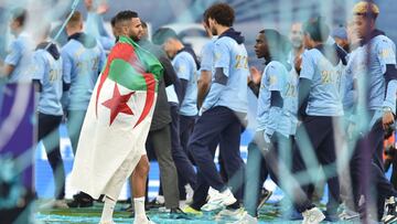 Soccer Football - Premier League - Manchester City v Everton - Etihad Stadium, Manchester, Britain - May 23, 2021 Manchester City&#039;s Riyad Mahrez celebrates with the flag of Algeria after winning the Premier League Pool via REUTERS/Peter Powell EDITOR