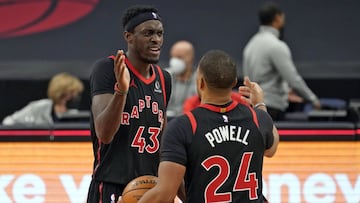 Toronto Raptors forward Pascal Siakam (43) celebrates with guard Norman Powell (24) after the team defeated the Philadelphia 76ers during an NBA basketball game Sunday, Feb. 21, 2021, in Tampa, Fla. (AP Photo/Chris O'Meara)