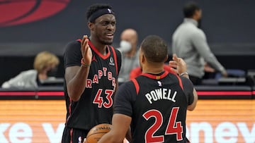 Toronto Raptors forward Pascal Siakam (43) celebrates with guard Norman Powell (24) after the team defeated the Philadelphia 76ers during an NBA basketball game Sunday, Feb. 21, 2021, in Tampa, Fla. (AP Photo/Chris O&#039;Meara)