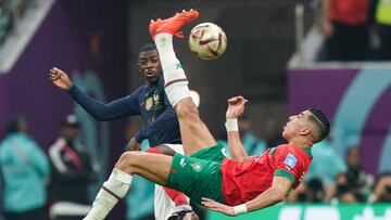 AL KHOR, QATAR - DECEMBER 14: Ousmane Dembele (L) of France fights for the ball with Jawad El Yamiq (R) of Morocco during the FIFA World Cup Qatar 2022 semi final match between France and Morocco at Al Bayt Stadium on December 14, 2022 in Al Khor, Qatar. (Photo by Khalil Bashar/Jam Media/Getty Images)