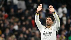 Real Madrid's English midfielder #5 Jude Bellingham waves during the UEFA Champions League last 16 second leg football match between Real Madrid CF and RB Leipzig at the Santiago Bernabeu stadium in Madrid on March 6, 2024. (Photo by JAVIER SORIANO / AFP)