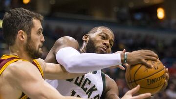 Nov 29, 2016; Milwaukee, WI, USA; Milwaukee Bucks center Greg Monroe (15) and Cleveland Cavaliers forward Kevin Love (0) battle for control of the ball during the fourth quarter at BMO Harris Bradley Center. Mandatory Credit: Jeff Hanisch-USA TODAY Sports