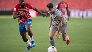 Granada&#039;s French defender Dimitri Foulquier (L) vies with Athletic Bilbao&#039;s Spanish midfielder Jon Morcillo during the Spanish league football match Granada FC against Athletic Club Bilbao at Los Carmenes stadium in Granada on September 12, 2020