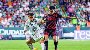 James Rodriguez (L) of Leon fights for the ball with Ivan Tona (R) of Tijuana during the 10th round match between Leon and Tijuana as part of the Liga BBVA MX, Torneo Clausura 2025 at Nou Camp Stadium, on March 01, 2025 in Leon, Guanajuato, Mexico.