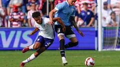 KANSAS CITY, KANSAS - JUNE 05: Tyler Adams #4 of the United States defends against Darwin Nuñez #11 of Uruguay during the second half of the friendly match at Children's Mercy Park on June 05, 2022 in Kansas City, Kansas. (Photo by Kyle Rivas/Getty Images)