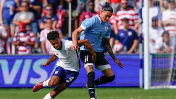 KANSAS CITY, KANSAS - JUNE 05: Tyler Adams #4 of the United States defends against Darwin Nuñez #11 of Uruguay during the second half of the friendly match at Children's Mercy Park on June 05, 2022 in Kansas City, Kansas. (Photo by Kyle Rivas/Getty Images)