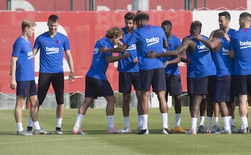 Barcelona players give Griezmann, De Jong and Neto the traditional welcome as the new arrivals are invited to run the gauntlet of "collejas" - well-meaning attempts to land a slap on the back of the new boys' necks.