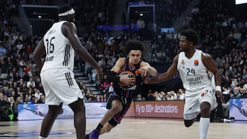 Nadir Hifi (C) of Paris Basket in action against Usman Garuba (L) and Andres Feliz (R) of Real Madrid during the EuroLeague Basketball match between Paris Basketball and Real Madrid, in Paris, France, 27 January 2026.