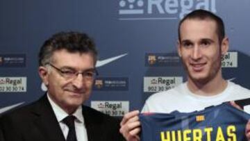 Creus y Marcelinho Huertas.