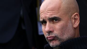 Manchester City's Spanish manager Pep Guardiola arrives ahead of kick off in the English Premier League football match between Fulham and Manchester City at Craven Cottage in London on April 30, 2023. (Photo by ADRIAN DENNIS / AFP) / RESTRICTED TO EDITORIAL USE. No use with unauthorized audio, video, data, fixture lists, club/league logos or 'live' services. Online in-match use limited to 120 images. An additional 40 images may be used in extra time. No video emulation. Social media in-match use limited to 120 images. An additional 40 images may be used in extra time. No use in betting publications, games or single club/league/player publications. /