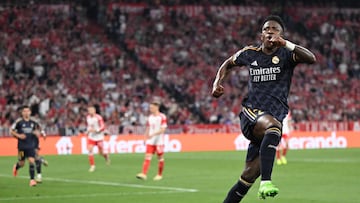 Real Madrid's Brazilian forward #07 Vinicius Junior celebrates scoring a penalty during the UEFA Champions League semi-final first leg football match between FC Bayern Munich and Real Madrid CF on April 30, 2024 in Munich, southern Germany. (Photo by Kirill KUDRYAVTSEV / AFP)