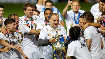 FILE PHOTO: Soccer Football - Championship - Leeds United v Charlton Athletic - Elland Road, Leeds, Britain - July 22, 2020   Leeds United players and manager Marcelo Bielsa celebrate winning the Championship and promotion to the Premier League, as play resumes behind closed doors following the outbreak of the coronavirus disease (COVID-19)   Action Images via Reuters/Lee Smith - RC2LYH9JFRJY/File Photo