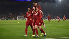 Liverpool&#039;s English midfielder James Milner (C) celebrates with teammates after scoring their second goal from the penalty spot during the English Premier League football match between Leicester City and Liverpool at King Power Stadium in Leicester, 