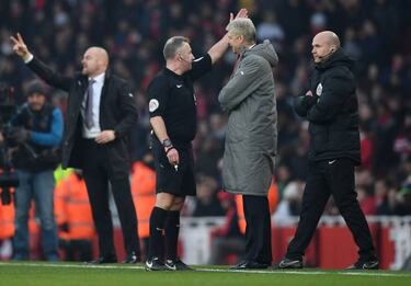 Dismissed Wenger apologises for clash with official