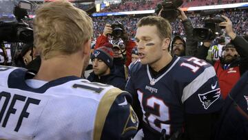 FILE- In this Dec. 4, 2016, file photo, New England Patriots quarterback Tom Brady right, speak at midfield to Los Angeles Rams quarterback Jared Goff after the Patriots won 26-10 in an NFL football game in Foxborough, Mass. The wide-eyed, talented Goff will try to lead his Rams past the grizzled, 41-year-old Brady, who is looking to guide the Patriots to their sixth Super Bowl victory.  (AP Photo/Steven Senne, File)