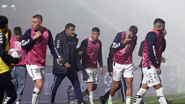 Gimnasia y Esgrima players react after police fired tear gas and entered the Juan Carmelo Zerillo stadium during the Argentine Professional Football League 2022 Tournament match between Gimnasia y Egrima and Boca Juniors in La Plata, Argentina on October 6, 2022. - A supporter of the Gimnasia soccer club died during serious incidents that broke out during an Argentine league match between his team and Boca Juniors on Thursday in Buenos Aires, according to local authorities. "I confirm that there is a dead person. This person died of cardiac arrest," said the Minister of Security of the province of Buenos Aires, Sergio Berni. The match was stopped in the 9th minute due to clashes inside and outside the stadium. (Photo by ALEJANDRO PAGNI / AFP)